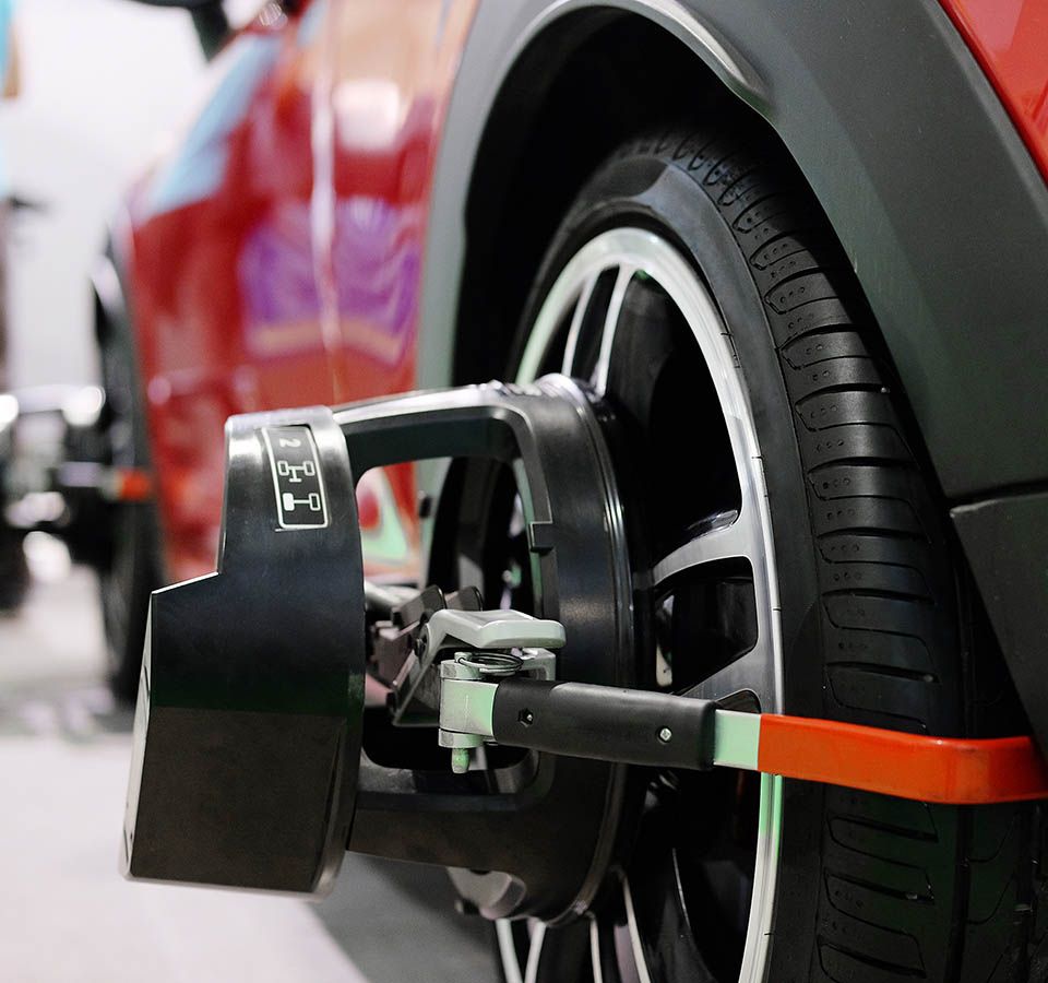 Wheel alignment equipment on a car wheel